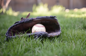 A white baseball with a glove: Baseball Gifts for Boys