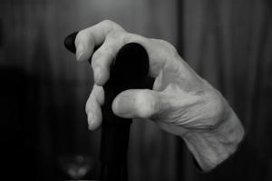 A older woman
gripping a walking cane, highlighting strength and resilience: Gifts For Older Women