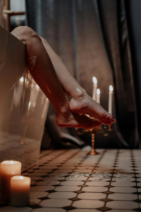 A woman is relaxing with aromatherapy candles