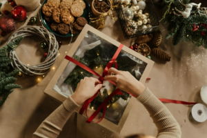 Top View of Woman Packing a Christmas Present