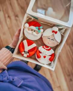 Woman Holding Box of Cupcakes
