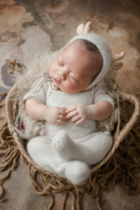 Newborn wearing White Knitwear
