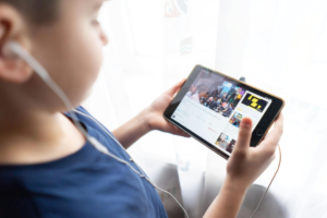 A Kid Holding Black Tablet Computer
