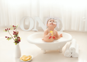 Adorable ethnic little girl in bathtub
