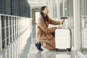 Excited woman with luggage