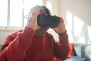 a Man in a Red Sweatshirt Holding a Virtual Reality Headset