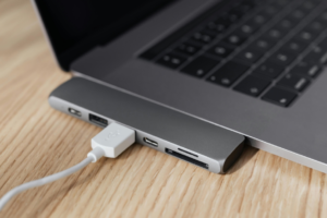 Laptop with type c adapter with plugged USB cable
