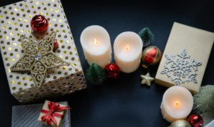 Decorative objects for Christmas in bright room on black table
