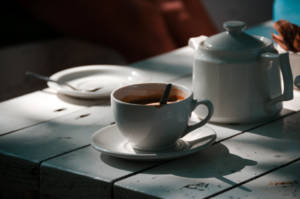 A Cup of Coffee and a Pot on the Table