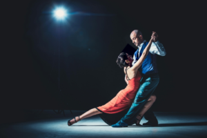 Woman And Man Dancing Under Light