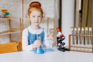 A Girl Holding Flasks
