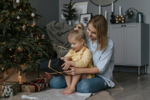 Girl in Yellow Sweater Holding Black Gift Box