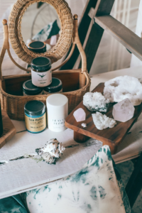 Natural cosmetics near assorted minerals on table
