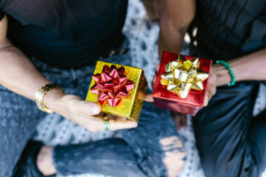 Two People Holding Gift Boxes