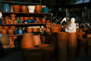 Clay Pots on Wooden Shelves