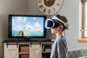 Boy Wearing a Black and White Virtual Reality Goggles
