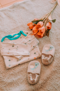 Baby Clothes Near Flowers
