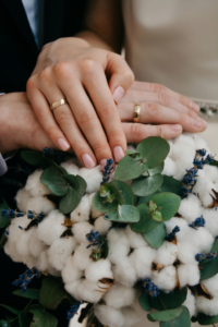 a woman is wearing rings in her both hands