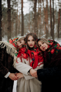 Beautiful Women in Coats Posing in Forest
