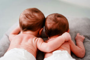 Back View of Newborn Twins Lying Close to Each Other