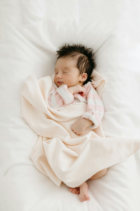 Toddler Sleeping in a Bed With A Soft Blanket