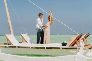 Romantic Couple on Dhow in Zanzibar's Turquoise Waters