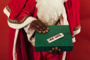 Person Holding Green Christmas Gift Box
