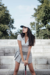 A Woman Wearing Trendy Golf Skirt