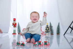 Joyful Baby Celebrating Christmas with Toys