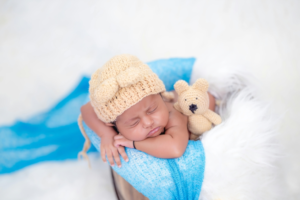 Sleeping Baby Wearing A Crocheted Hat