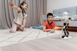 Kids Happily Looking at the Dancing Robot
