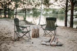 Black Camping Chairs on White Sand
