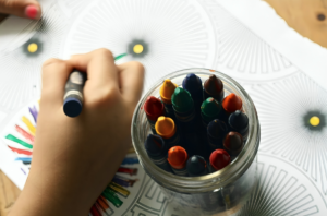 Kid Coloring Art With Crayons
