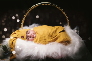 Adorable Newborn Baby Boy in Cozy Basket Portrait
