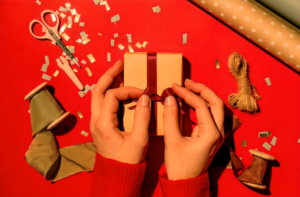 A Person Wrapping a Gift