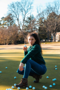 A Woman Is Wearing Golf Boots Which is A Awesome Golf Gifts For Women