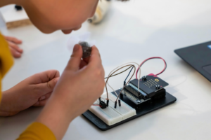 Kid Creating an Electronic Device
